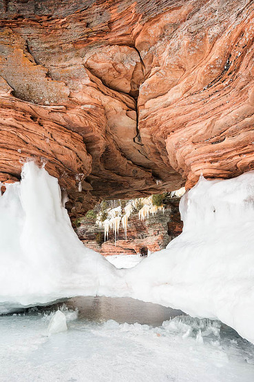 sandstone formations eroded by water and wind with ice