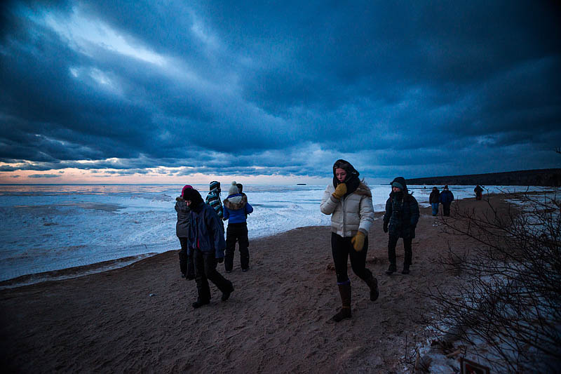 wind blown tourists at ice caves, Wisconsin