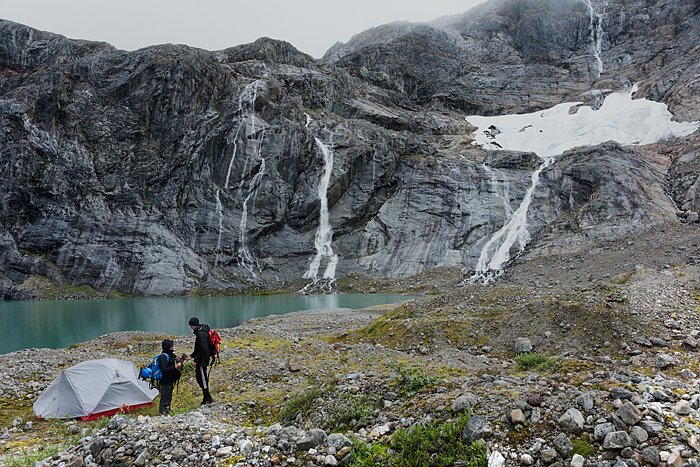 couple tent camping on glacier, walking on glacier ice, Juneau, Alaska