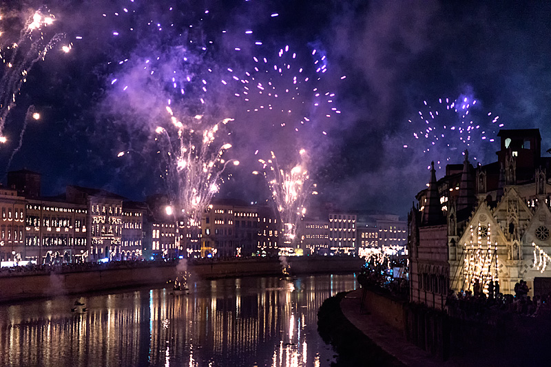 Pisa Luminara festival fireworks over Arno River