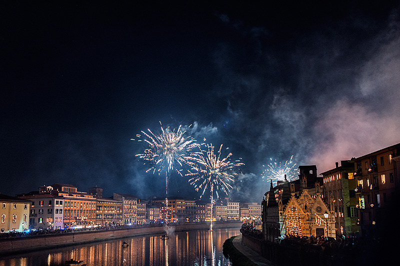 Pisa Luminara festival fireworks over Arno River